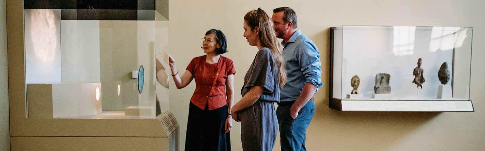 Cincinnati Art Museum curator of the mirror exhibit Hou-Mei Sung with museum guests