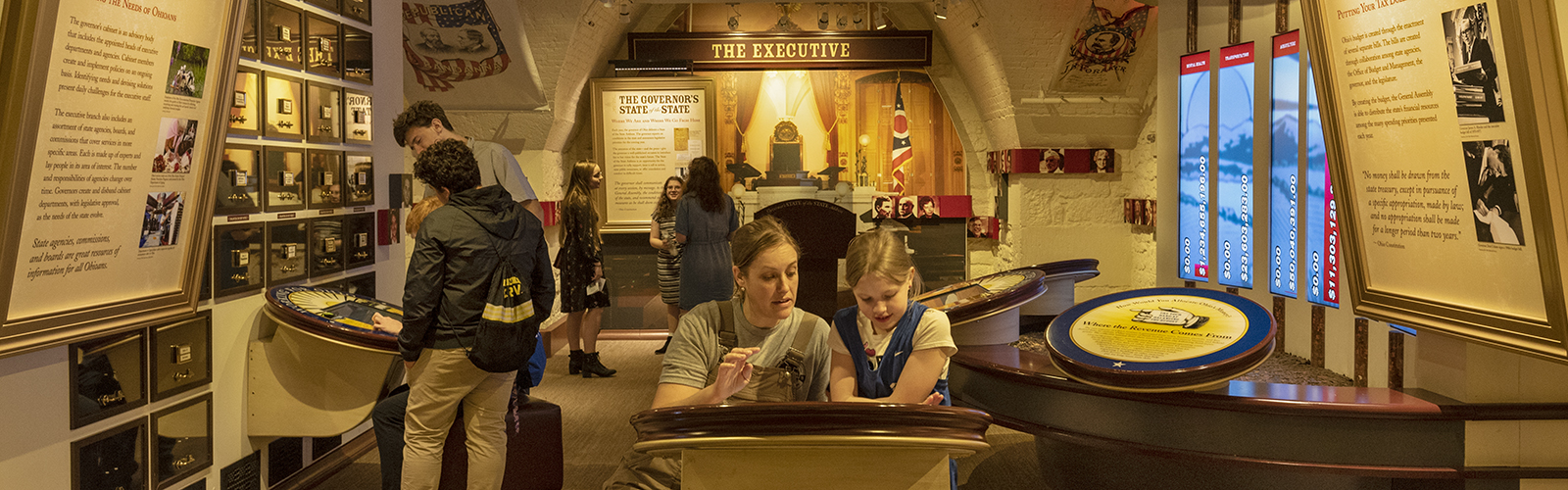 Monica and Bailey Craven explore interactive exhibits at the Ohio Statehouse Museum Education Center.