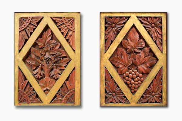 Two preserved carved wood panels from Music Hall's original organ.