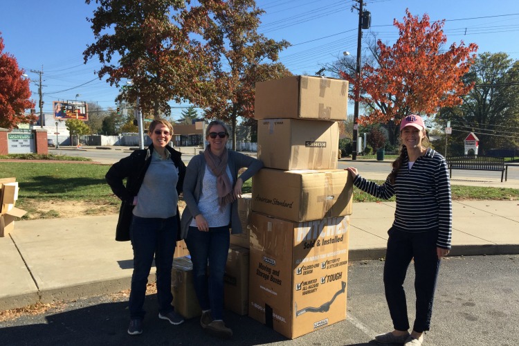 With the help of volunteers, Erin Fay (center) keeps tons of waste out of landfills.
