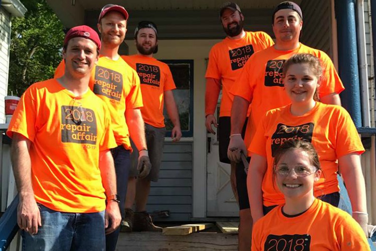 Volunteers fix up houses for residents in need.