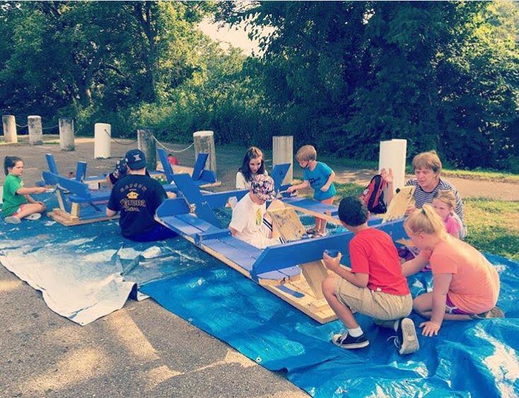 Kids help paint during the first Goebel Pool Paint Party. The second phase of painting will take place during Make a Difference Day.