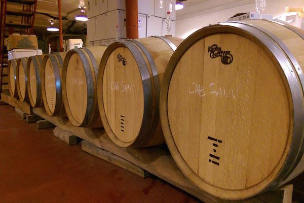Barrels age in Revel OTR's basement cellar