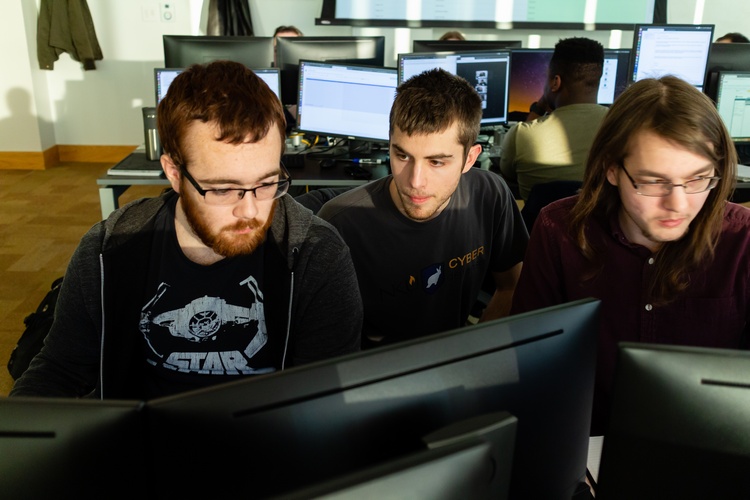 In the JRG Cyber Threat Intelligence Lab are Zeb Gentry, Bradley Hatting, and Justin Flynn.