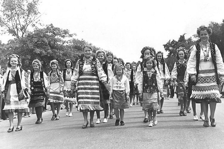 Women and youngsters wearing native dress march to the Ukrainian Cultural Garden in 1939.