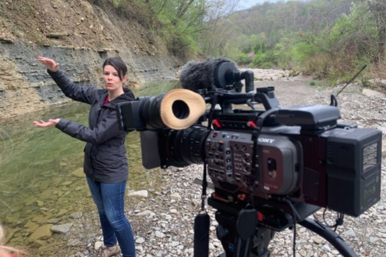 Cincinnati Museum Center geologist, Brenda Hunda, in creek