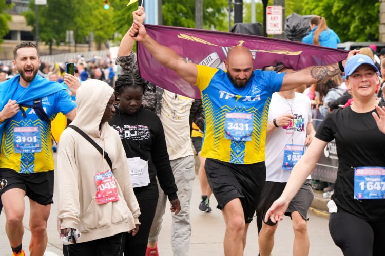 Ukrainian runners; Vadym Kovalenko, left, and Maksym Pasichnyk, right, at the Flying Pig Marathon.