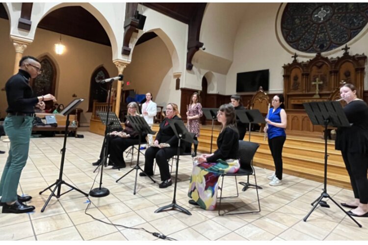 Kei Slaughter conducts flute choir at Pride Arts Showcase