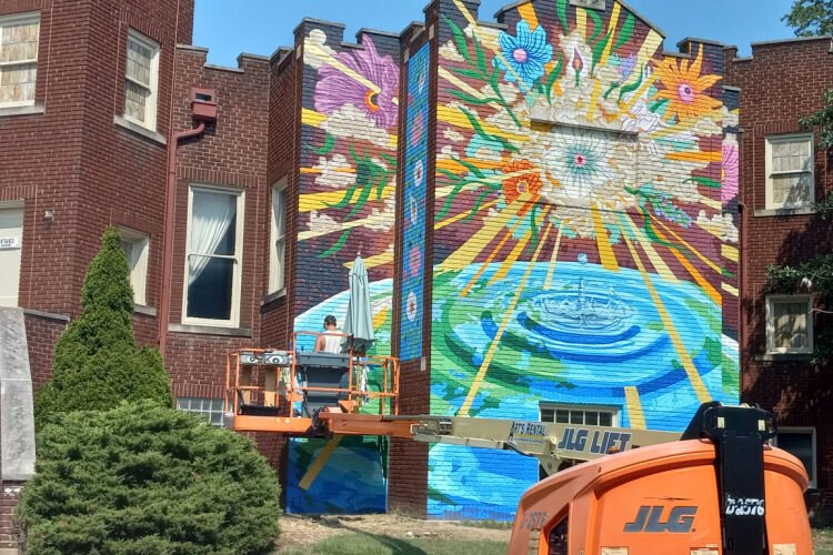 “The Beauty of Peace” mural spans three walls that face Minot and Brownway streets.