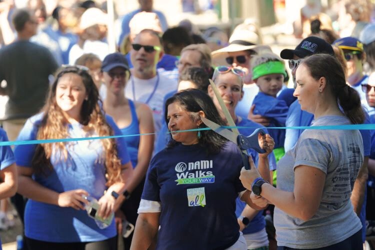 Julia Saldanha about to cut the ribbon at the NAMIWalks starting line.