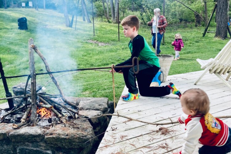 Vince M., 13, making s’mores in the backyard.