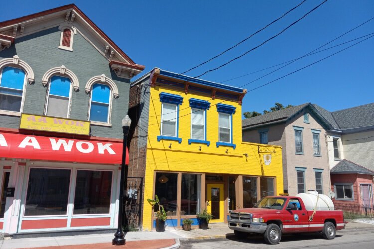 Unataza's brightly colored facade and handsome scroll-mounted sign beckons to travelers on Dayton's main drag.