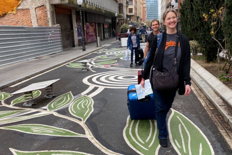 A contingent arriving at the hotel in Bilbao after three flights.