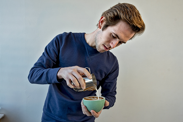 Austin making a latte.