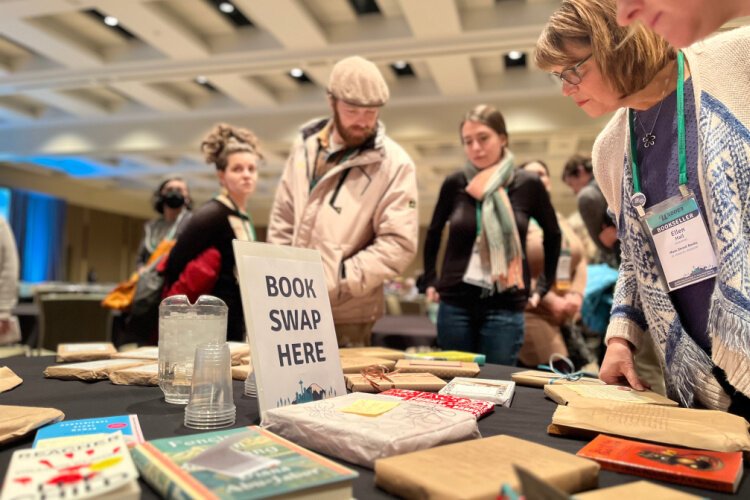 Attendees swap books at the Winter Institute.