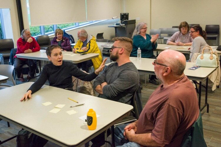 Participants at the Cuyahoga County Parma–Snow Branch enjoying a lively game of civics trivia.