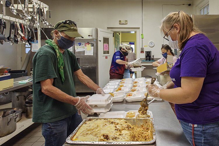 Volunteers from Washington UCC continue to serve the community during COVID-19. From l.to r.: Terry Long, Gary Oakes, Debbie Coleman, and Amy Townsend-Small.