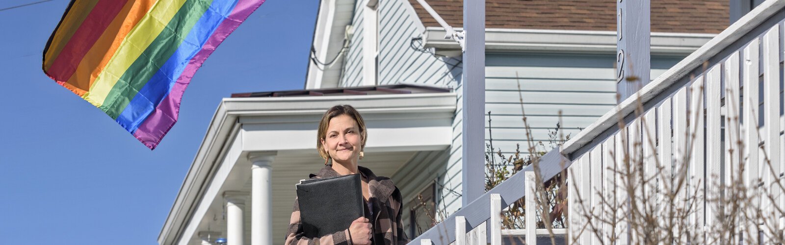 Realtor Emily Godin stands outside a home for sale on Superior Avenue. Deer Park has developed an initiative to draw young homebuyers and empty nesters to its community, touting its safety and walkability.