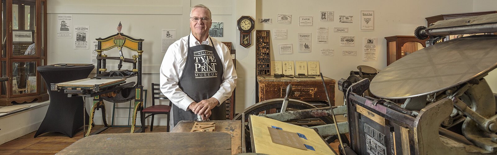 Gary Walton, founder of the Cincinnati Type & Print Museum with the 1917 C&P press.