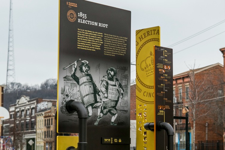 Signs with stories and facts about OTR's brewing history line the area.