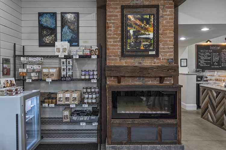 Shelves are stocked with locally made food and coffee.