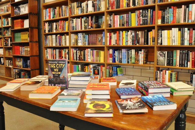 A welcoming table displays carefully arranged popular titles.