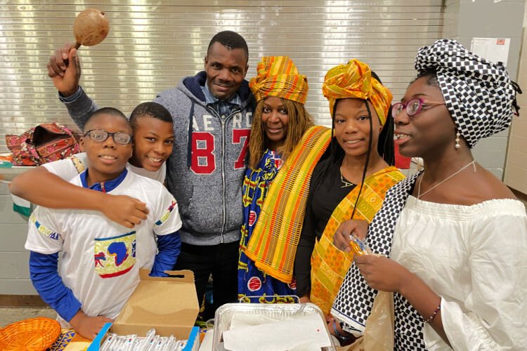 A family from Ivory Coast in West Africa welcome visitors to Boone County Schools International Festival. From left: Charles, Jeffrey, Aka Francis Otity, Djoukou Lobognon, Anaelle and Maeva.