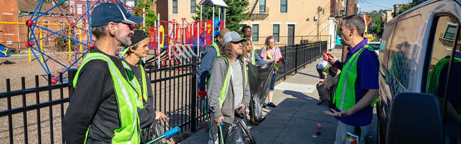 Jim Cira instructs a group ready to pick up trash for the day.