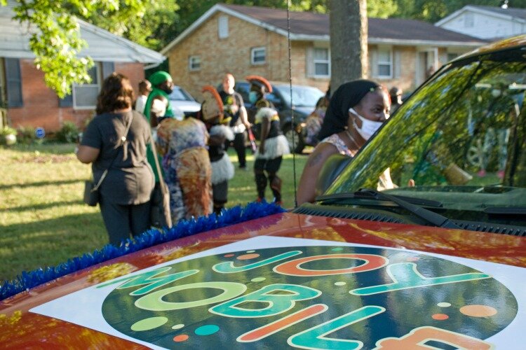 Just like an old-fashioned ice cream truck, the Joy Mobile (a decorated pick-up truck) will drive down selected streets playing music, and neighbors are invited to come out to their front yards to participate in the fun.