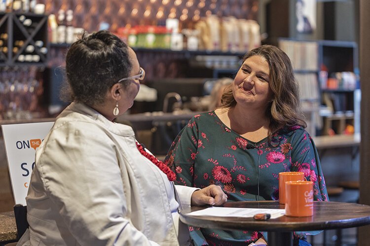 Kathryne Gardette interviewing musician Heather Verbeck Harrison during Soapbox's first Facebook Live Community Open Newsroom at Caffe Vivace.