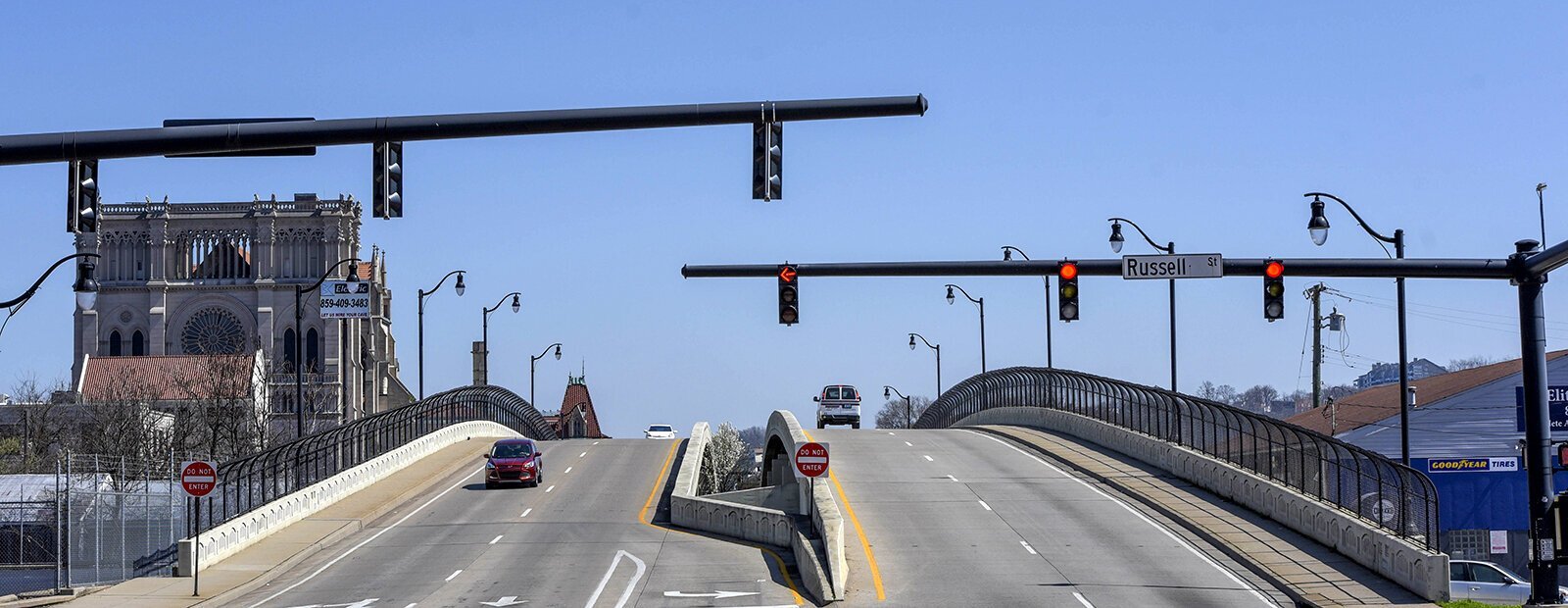 Martin Luther King Drive travels over railroad tracks that have been the traditional dividing line between Covington's Eastside and Westside. At left is the Cathedral Basilica of the Assumption.