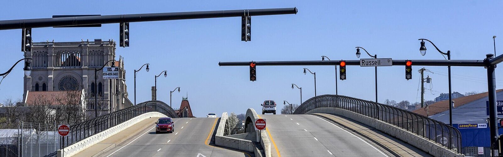 Martin Luther King Drive travels over railroad tracks that have been the traditional dividing line between Covington's Eastside and Westside. At left is the Cathedral Basilica of the Assumption.