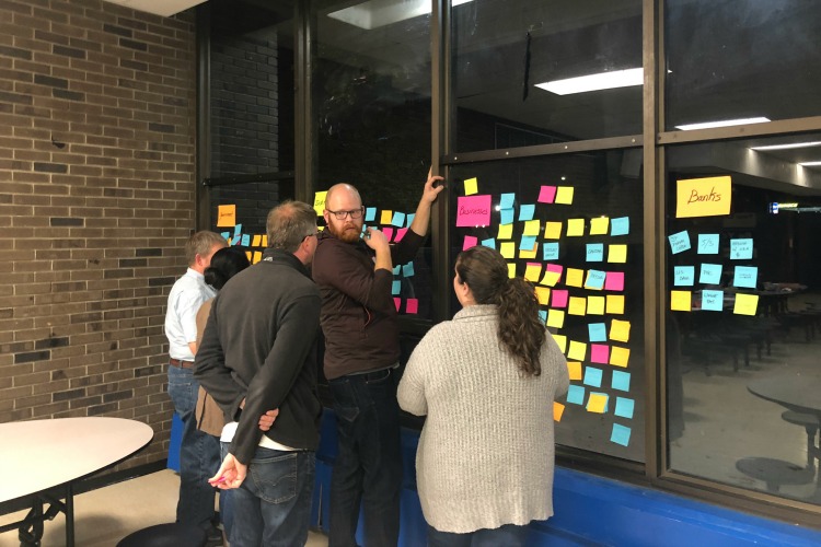 Volunteers brainstorm at a community-wide planning meeting.
