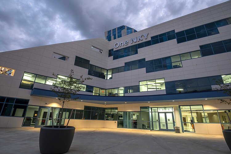 The pedestrian plaza at OneNKY Center at dusk.