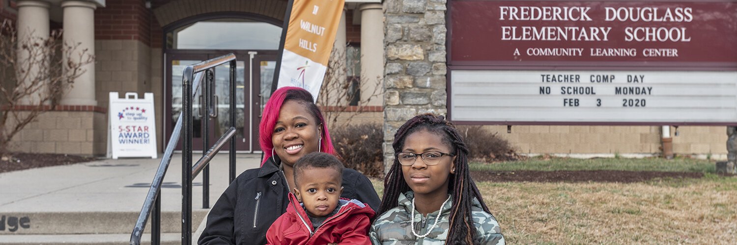 Sowonie Kollie and her children outside of the Frederick Douglass school in Walnut Hills.