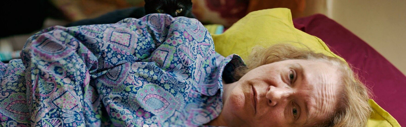 Nancy Rexroth and her cat, Cy, in their Clifton apartment.