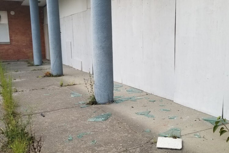 Broken glass litters the campus.