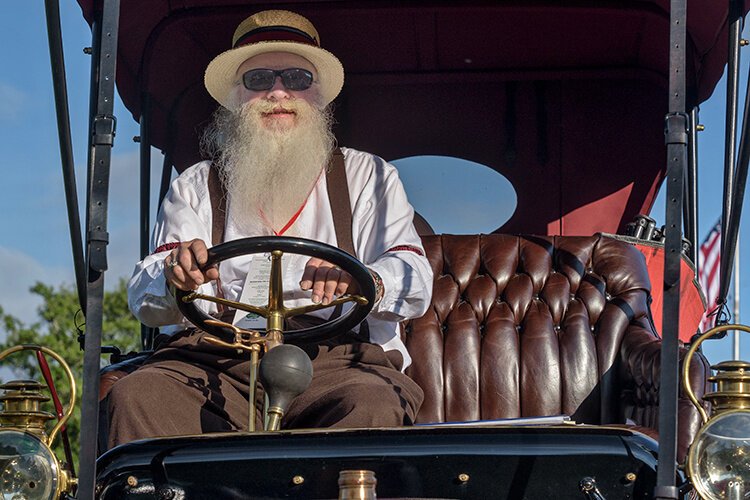There are vehicles more than a century old featured at the Concours d’Elegance, including this 1910s-vintage Cadillac piloted by this handsome gentleman.