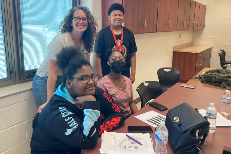 Voices of Youth students (front row) l to r, Tamia and Lorraine, (back) writer Liz McEwan with Kendall