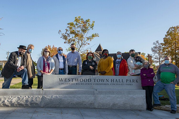 The renovated Westwood Town Hall Park includes a new playground, a plaza and community gathering space, new landscaping, terraced seating, and a dog park.