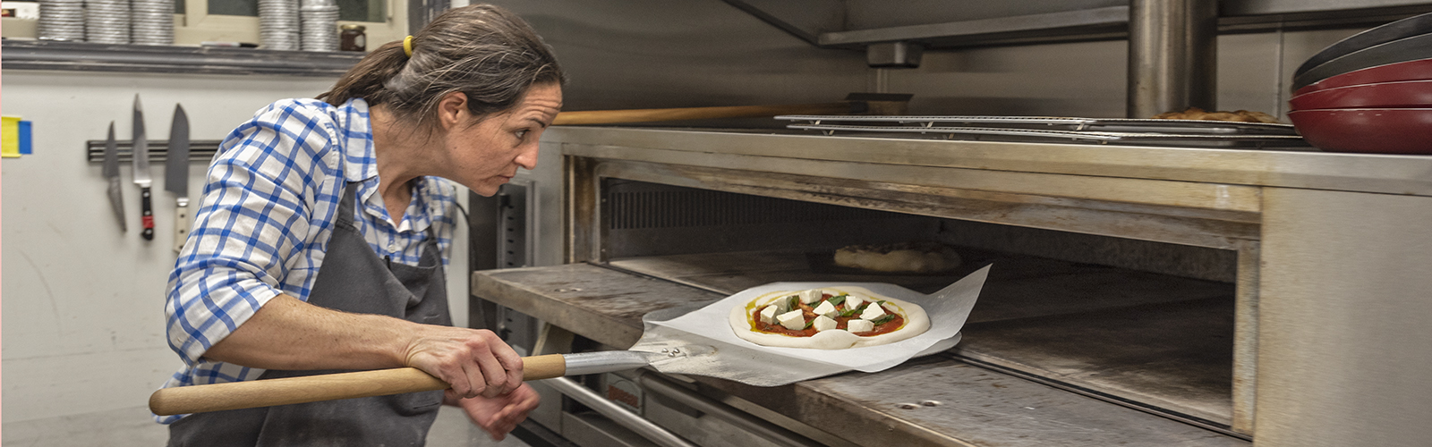 Chrissy Antenucci making pizza at The Wheel.