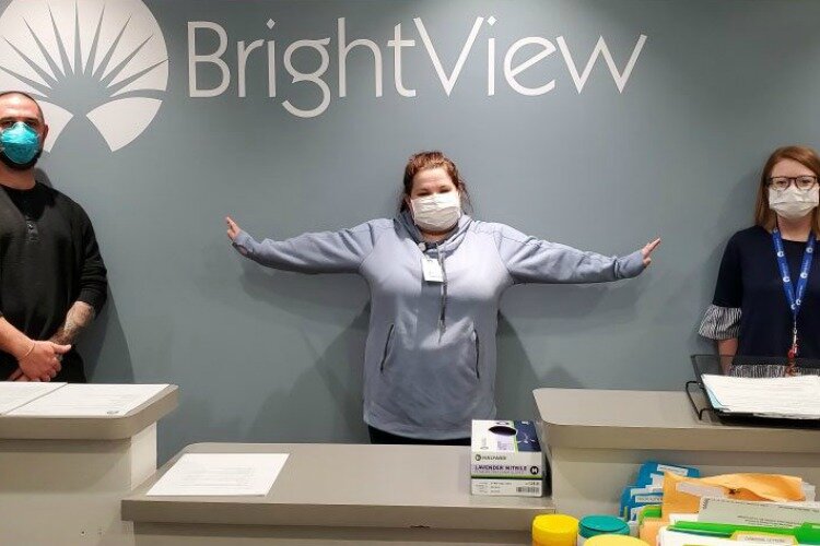 The BrightView "superhero" staff always wear masks.