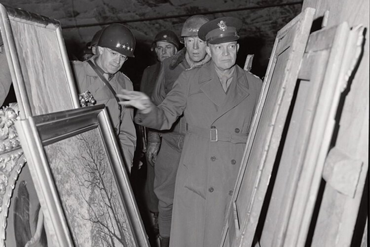 Generals Dwight D. Eisenhower, Omar N. Bradley, and George S. Patton, seen here scrutinising the paintings found in the salt mines near Merkers ( 12 April 1945).