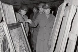 Generals Dwight D. Eisenhower, Omar N. Bradley and George S. Patton, seen here scrutinising the paintings found in the salt mines near Merkers ( 12 April 1945).