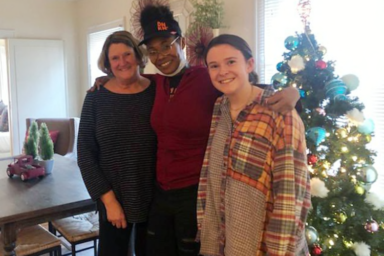 Ebony Johnson (center) with Suzanne Burke and her daughter.