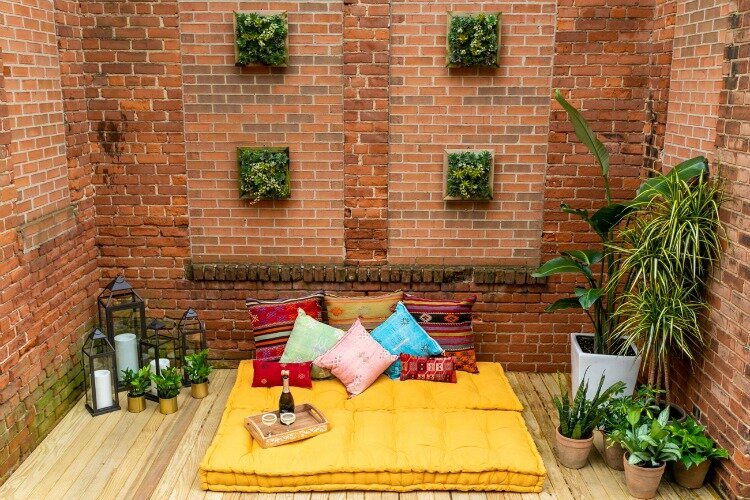 The patio is designed as an urban oasis with a variety of seating.