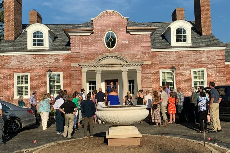 Robert Edmiston, executive director of Turner Farm, speaks to a group of staff at The Meshewa House ribbon cutting ceremony on August 16th.