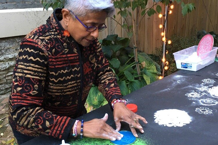 Radha Lakshmi doing mandala making at the Kennedy Heights Arts Center Annex. 