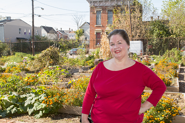 Betty Winters Waite poses at Concord Community Garden in Walnut Hills. 