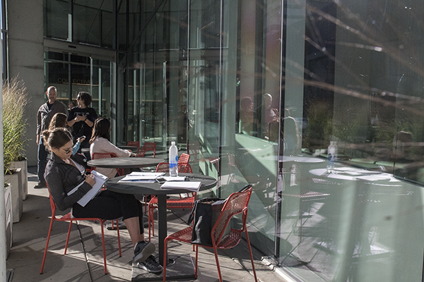 Visitors to the CAC enjoy autumn sunshine on the patio of Collective Espresso.
